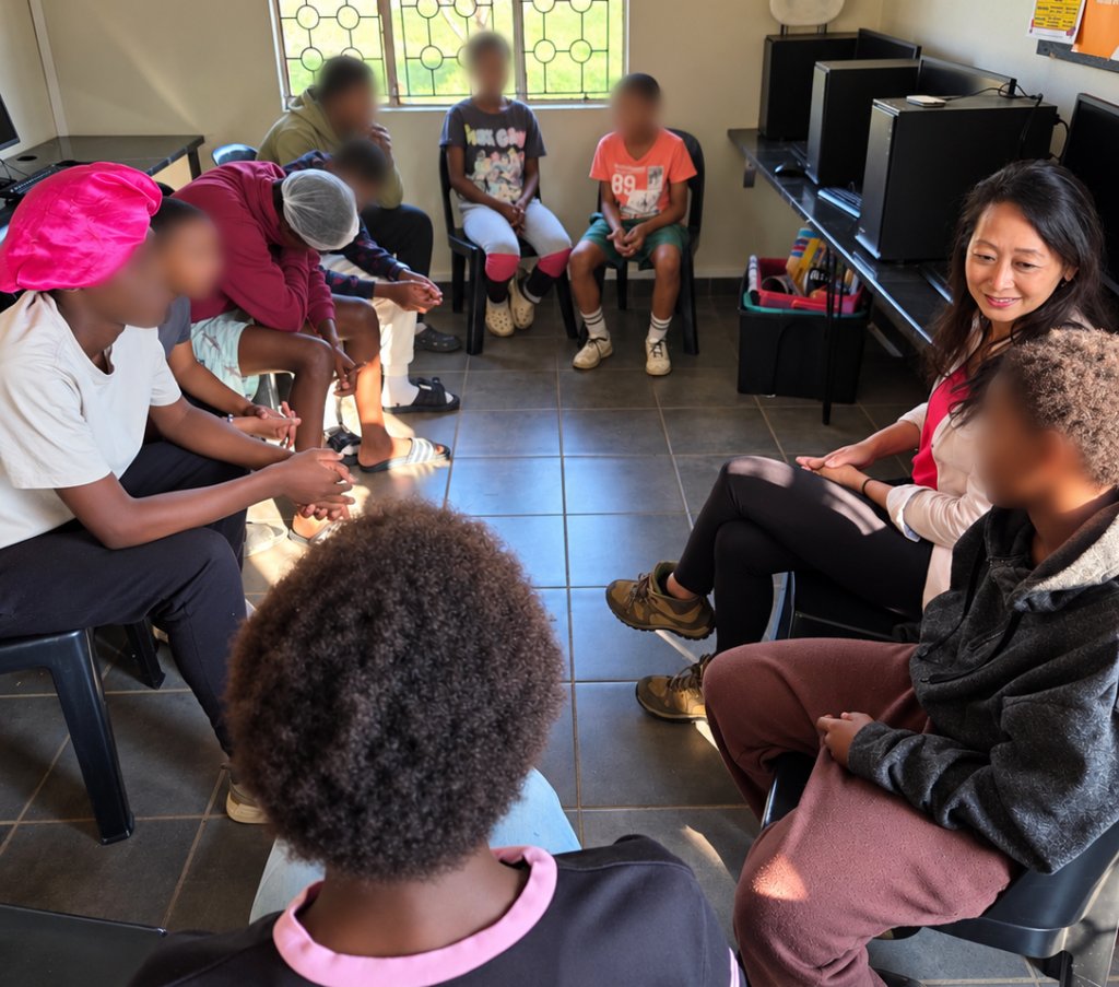 Teenagers at Ya Bana Village during a financial literacy discussion